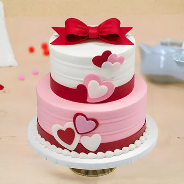 bow and heart anniversary cake