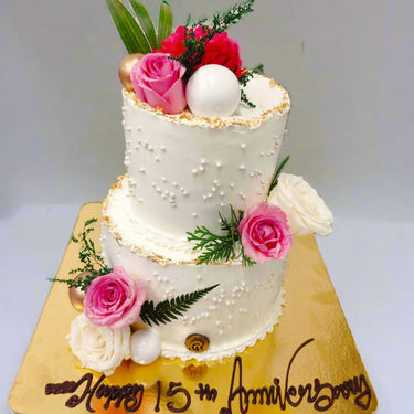 Two tier flora anniversary cake