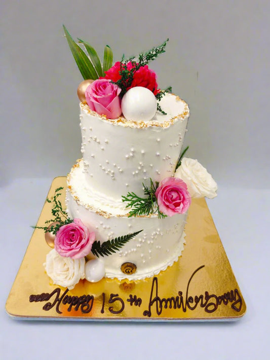Two tier flora anniversary cake