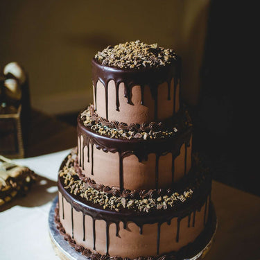 Chocolate dripping anniversary cake