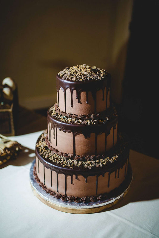 Chocolate dripping anniversary cake